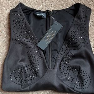 NWT Bebe sequined peplum top